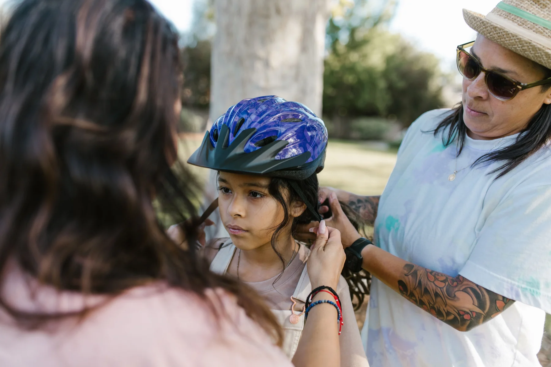 Getting a cycling helmet fitted before a family ride